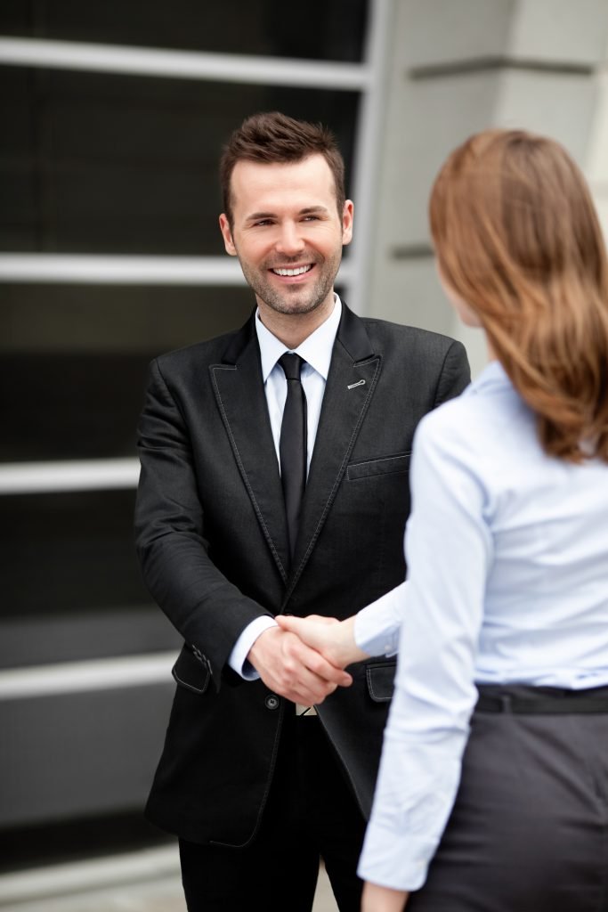 Two business people shaking hands