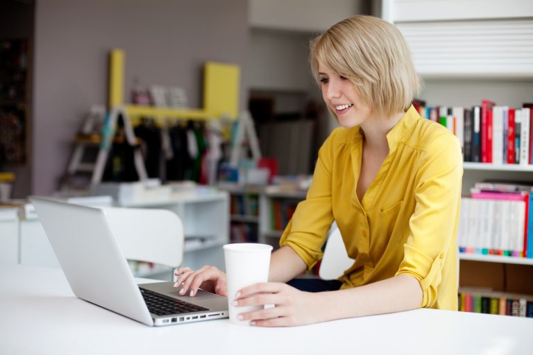 Young female professional working on laptop