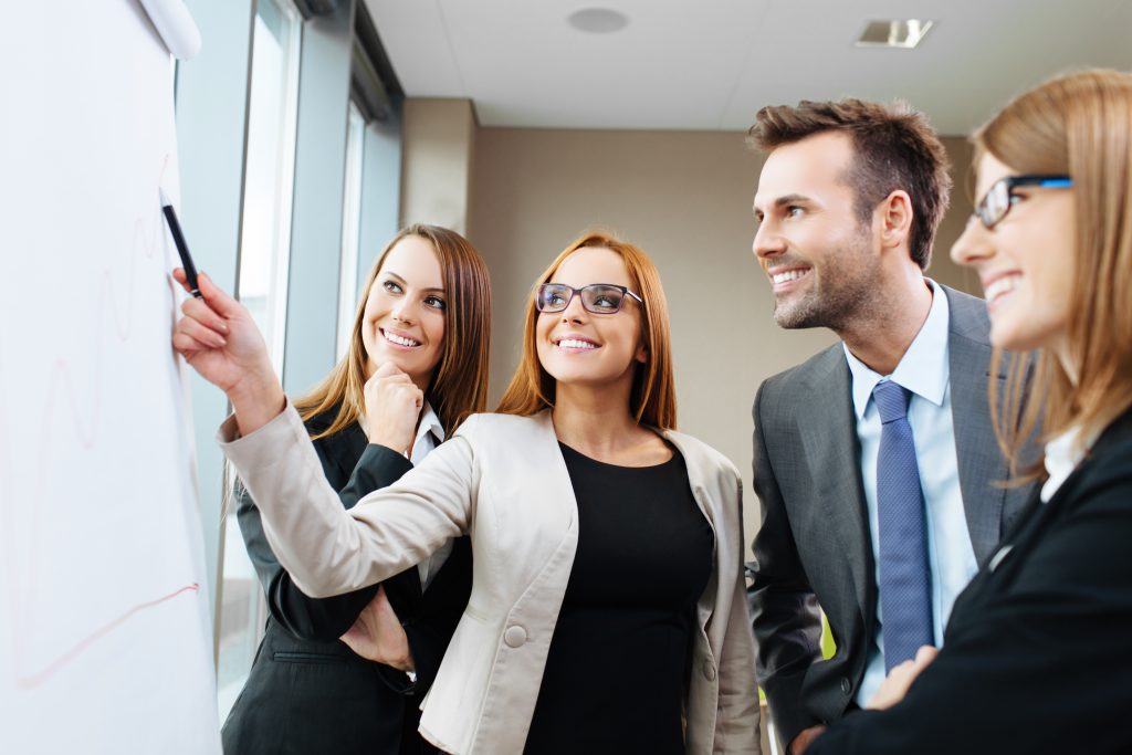 Team in office looking at a flipchart