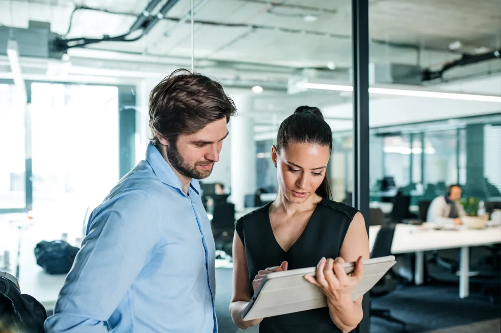 Two team members working together on a project